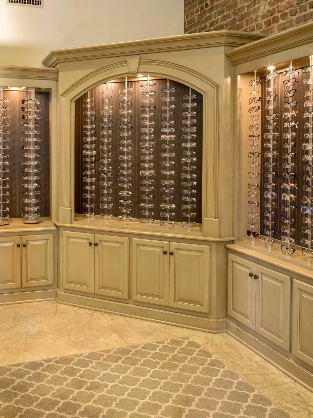 A wall of designer frames in the Wood Eye Clinic optical boutique